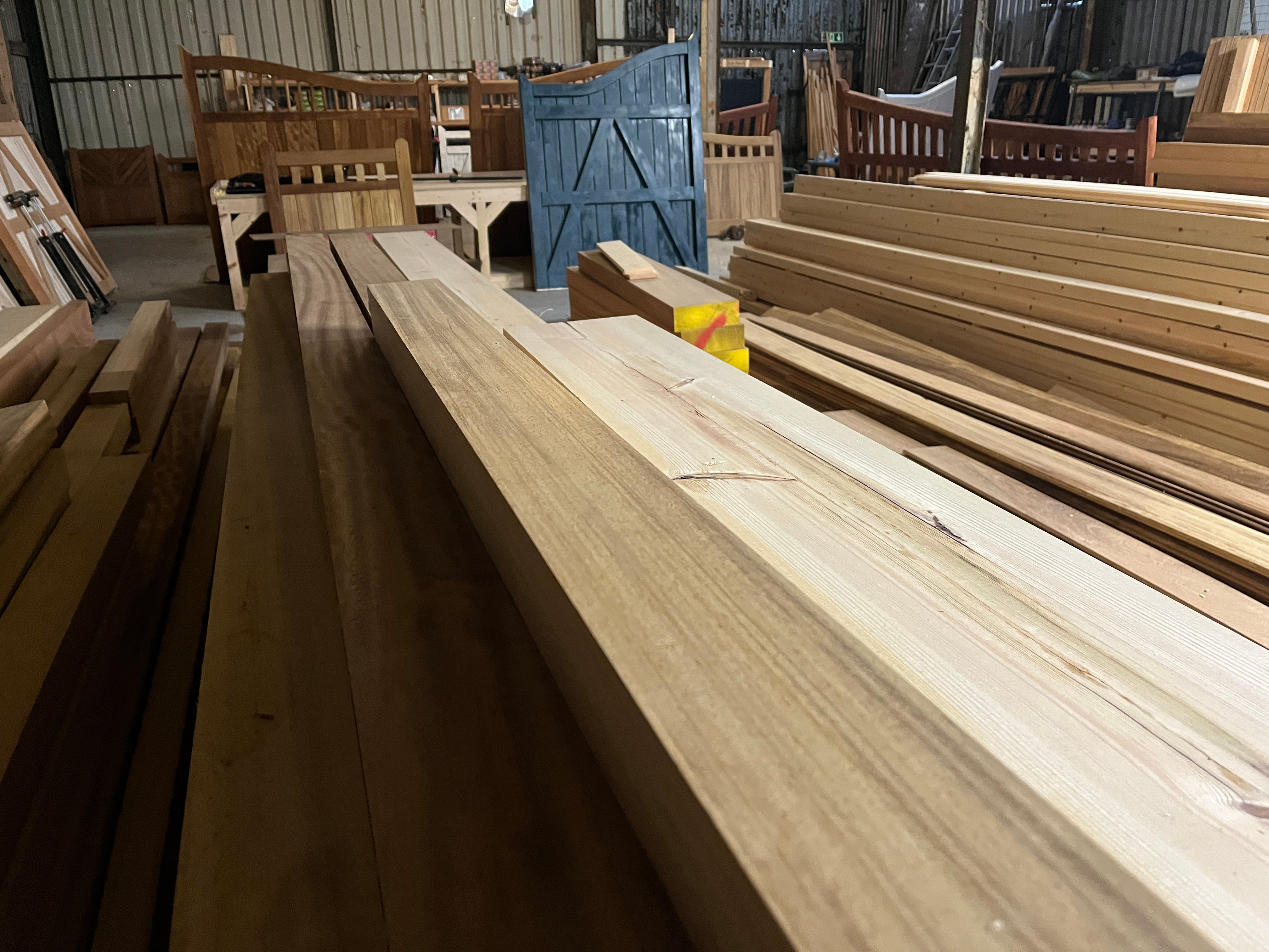 Timber Yard Supplying Planks And Beams In Hardwood Iroko Front View