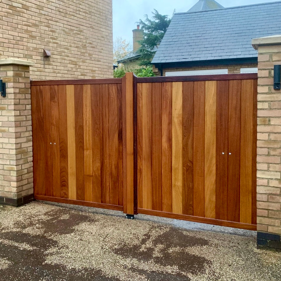 Thumbnail: Oiled Hardwood Driveway Gates Installed On Brick Piers