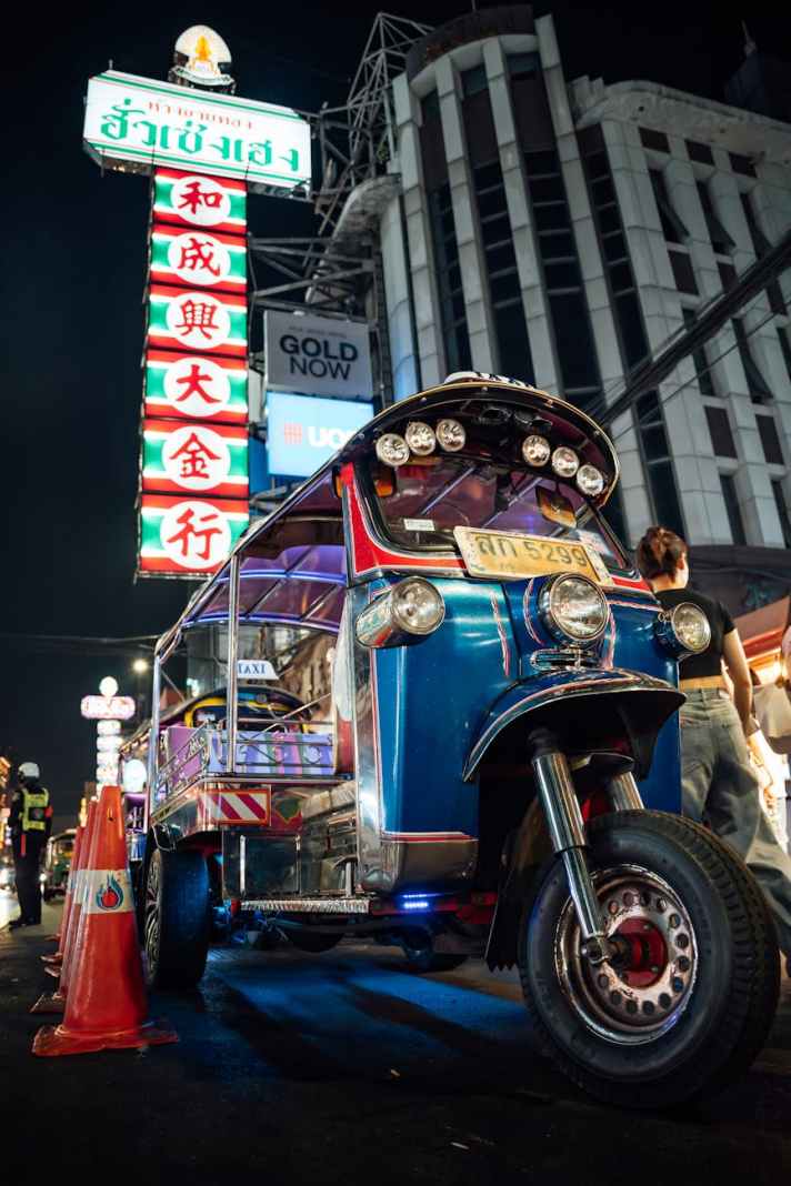iconic tuk tuk in bangkok night street scene