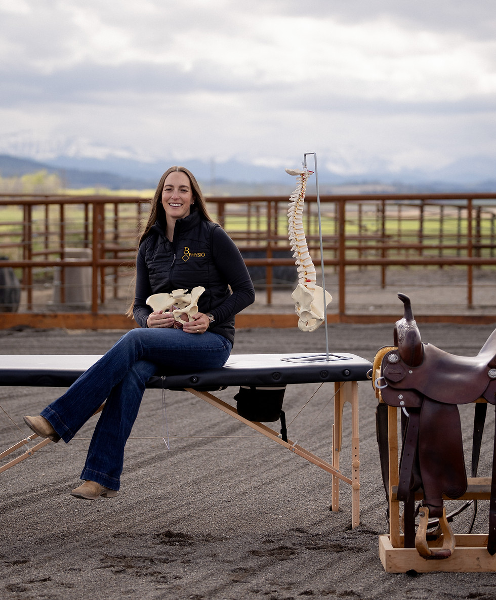 women sitting on a bench holding a hip bone prop to represent the physiotherapy work that she does