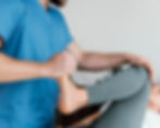 osteopathic-doctor-checking-female-patient-s-leg-movement.jpg