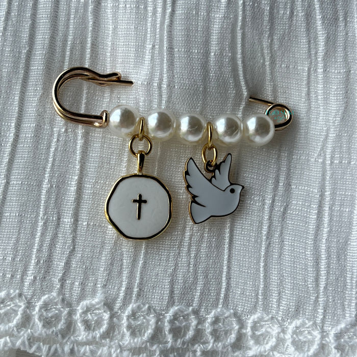 Gold Catholic pin with dove symbol representing the Holy Spirit