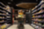 woman-pushing-shopping-cart-shelves-supermarket.jpg