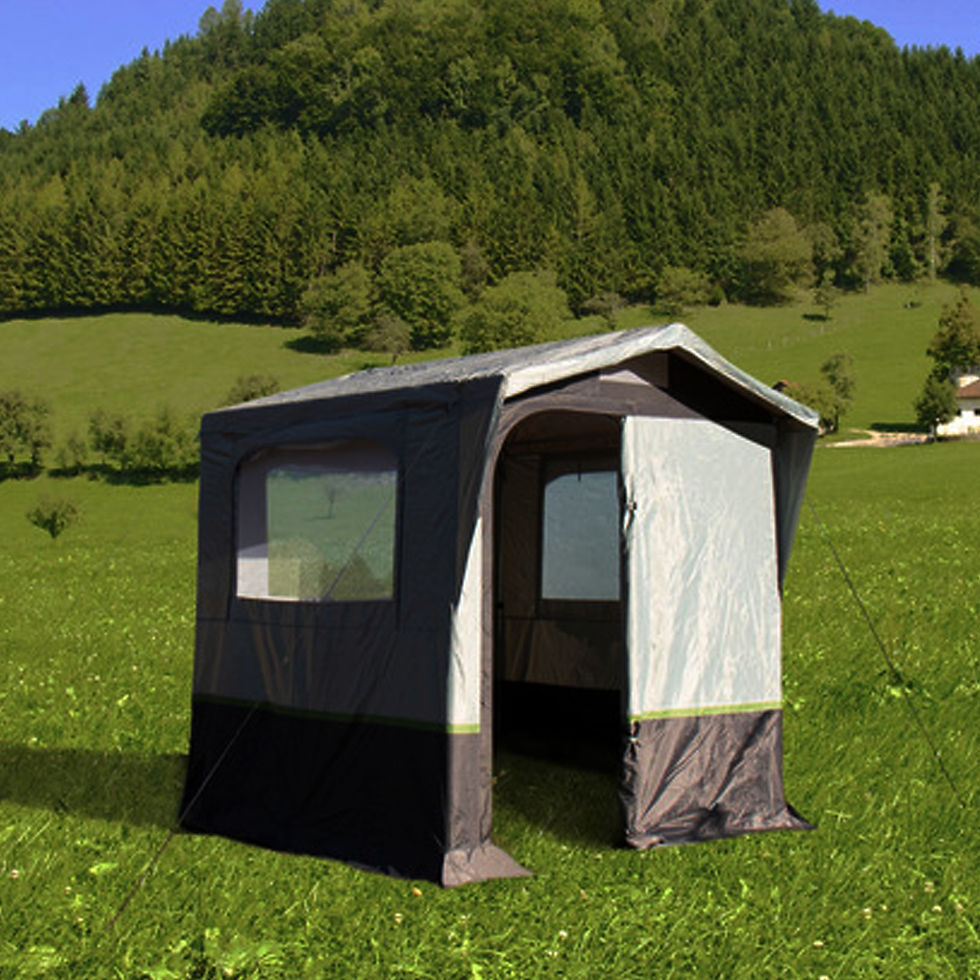 ALICANTE Kitchen / Equipment Tent set up on grassy field with open entrance and side windows, surrounded by green hills