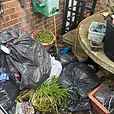 concrete table with bags of rubbish on top as well as under and beside it