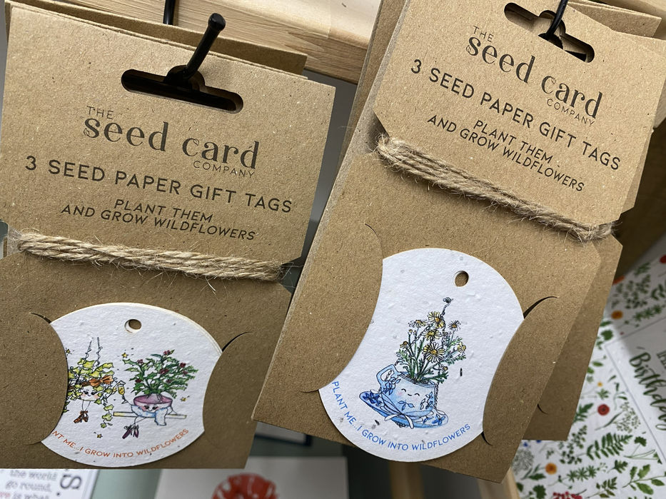 The Seed Card Company round off white paper gift tags with images of potted plants.
