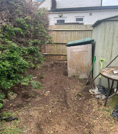 cleared space in front of metal shed