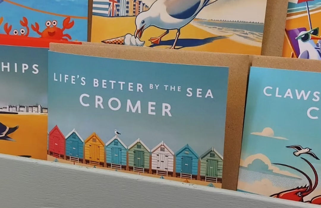selection of greetings cards depicting colourful seaside scenes