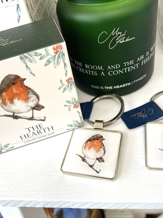 white soap box, and keyring with watercolour robin painting and green glass reed diffuser bottle