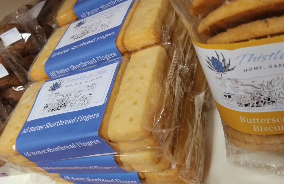 Packets of shortbread biscuits branded with Thistle and Tide logo