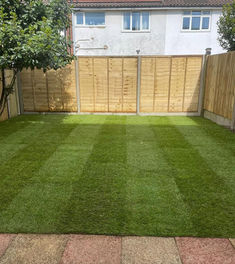 whole garden with cleaned patio, new turf and new close board fencing