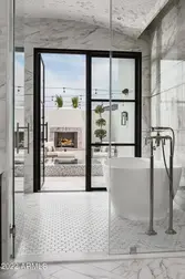 outdoor fire feature visible from bathtub.