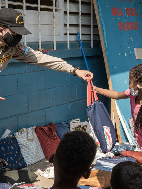 Bombero gives school bag.jpeg