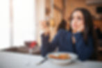 woman not sure what food she is about to eat