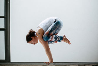 a serene woman practicing yoga, embodying balance, mindfulness, and inner strength as she integrates her holistic approach in