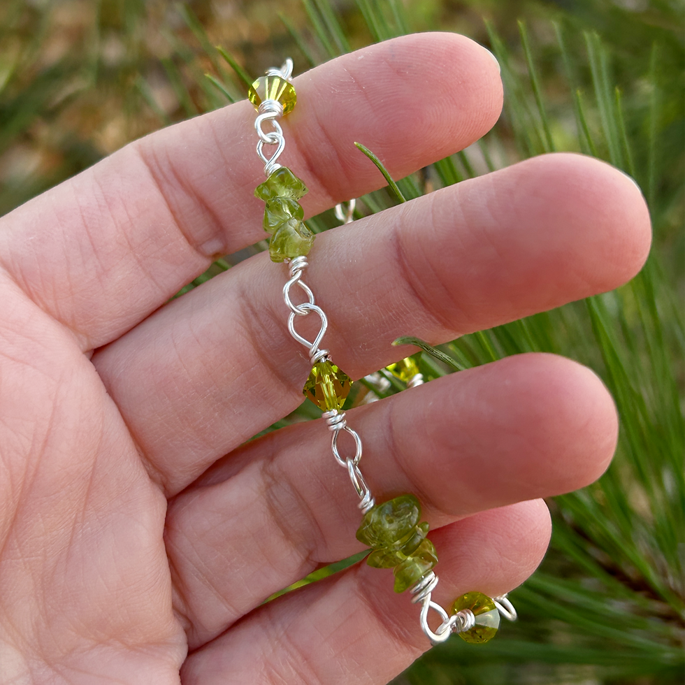 Handcrafted green natural peridot crsytal bracelet close up in someone's hand