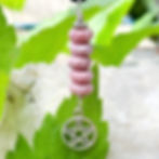 Rhodonite healing crystal jewelry for confidence and self love.  Pagan pentacle pendant by Wicked Stones in Canada