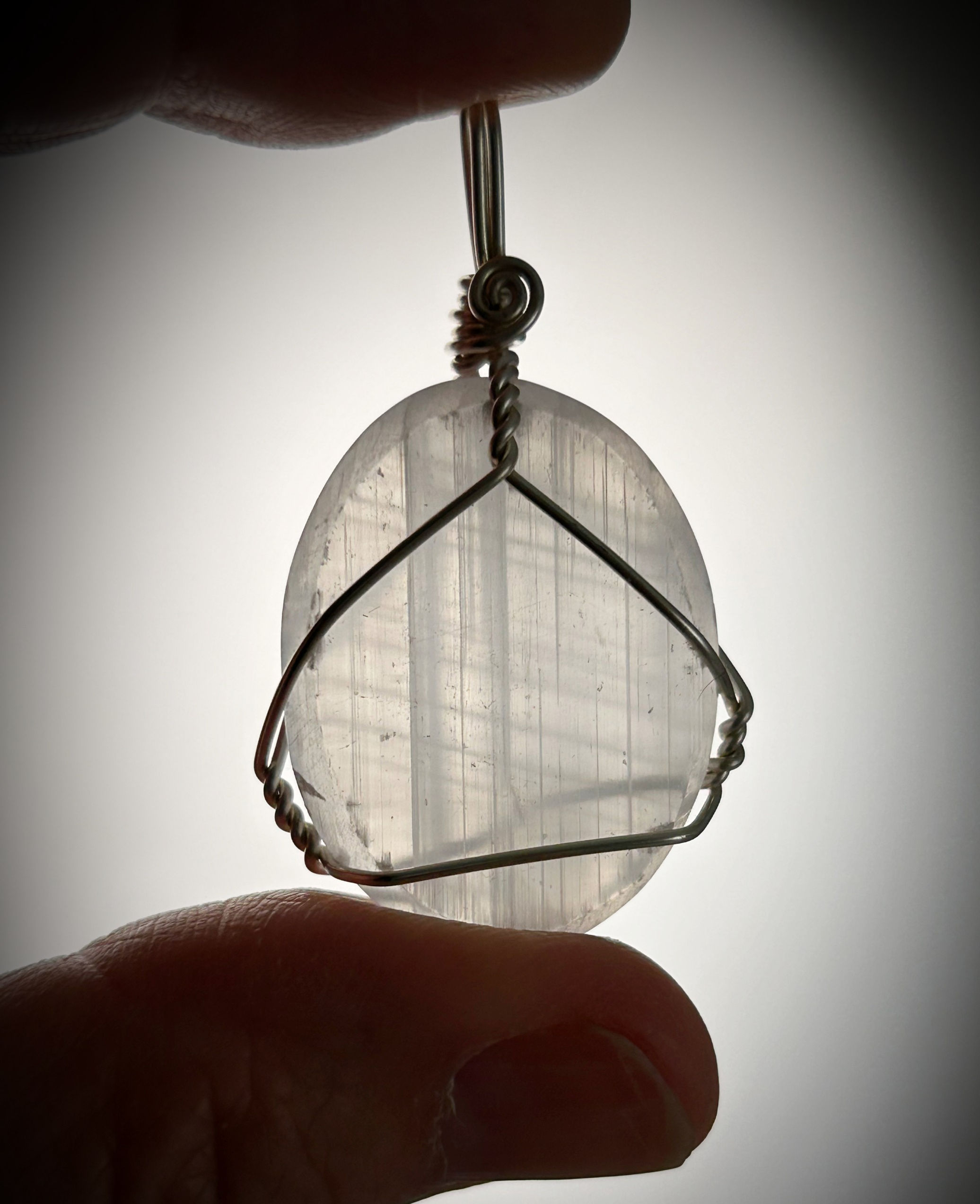 Selenite healing crystal pendant handmade by Wicked Stones healing gems in Canada