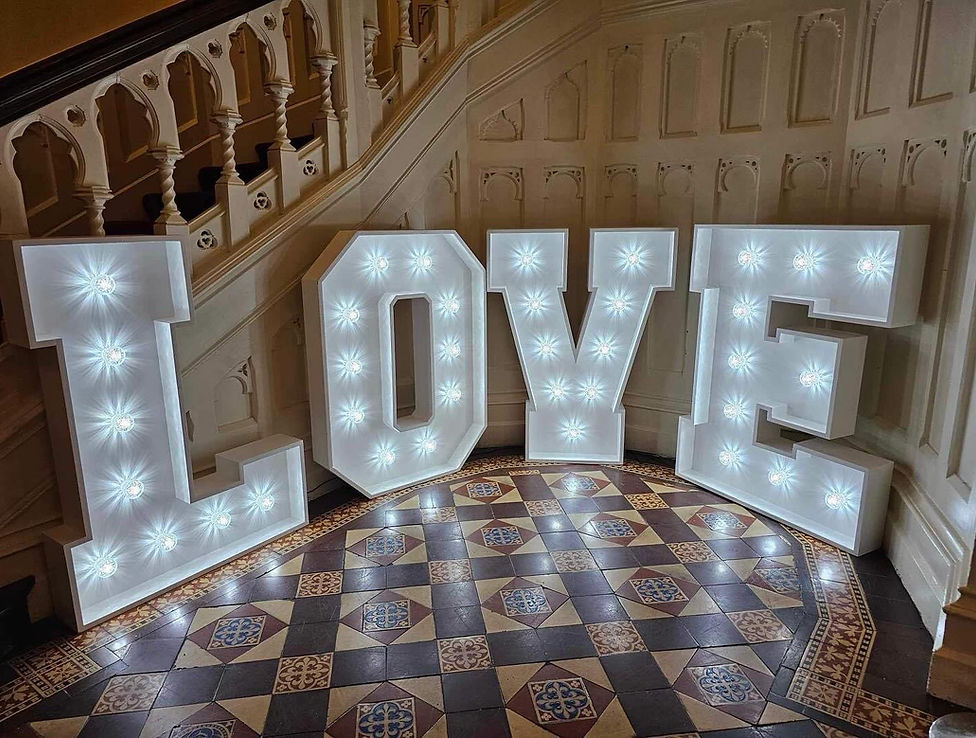 Giant 4ft light-up letters spelling LOVE for weddings and events