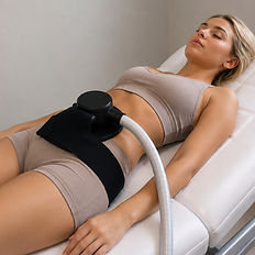 Client relaxing on a treatment bed during an EMS body sculpting session