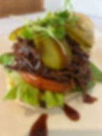 PULLED BEEF BRISKET IN SOURDOUGH ROLL, LOADED CHEESY CHIPS