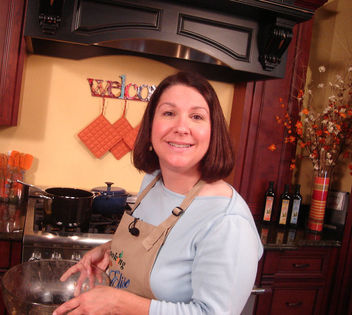 Candid photo Elise Johnson on the set of "Cooking With Elise"