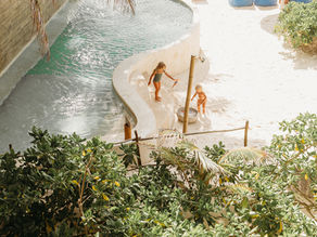 Kids playing at the seaside pool at Mahayana Tulum