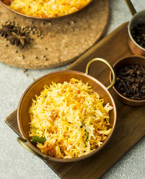 pan-with-rice-dish-near-spices-min.jpg