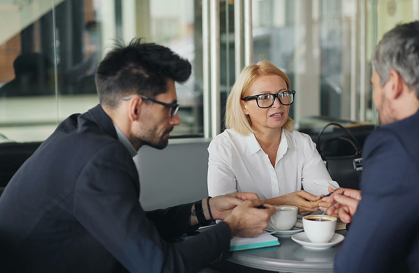 Two people sitting down talking