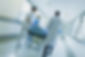 NPE Medical About Us Section Hoospital corridor with patient and doctors