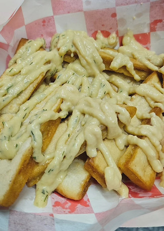 Pita Fries With Hummus. Flash-Fried Fresh Pita Bread Drizzled With Your Choice Of Hummus