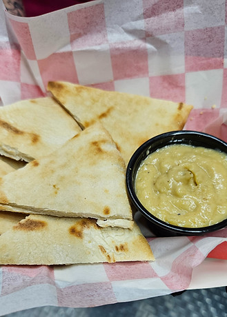 Grilled Pita With Hummus. Grilled Fresh Pita Bread (Baked Fresh For Us Daily) Served With Your Choice Of Hummus.