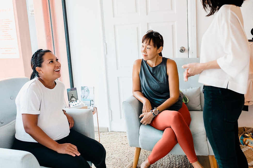 pregnant client talking to Embrace Physiotherapy Singapore