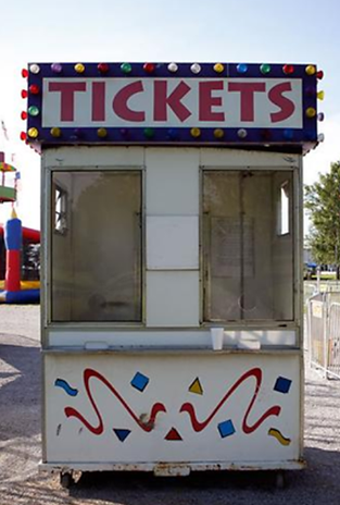 A-white-carnival-ticket-booth-with-TICKETS-on-top.png