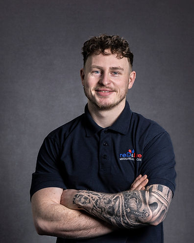 Professional Headshots, Engineering Team, young man, with arms folded.