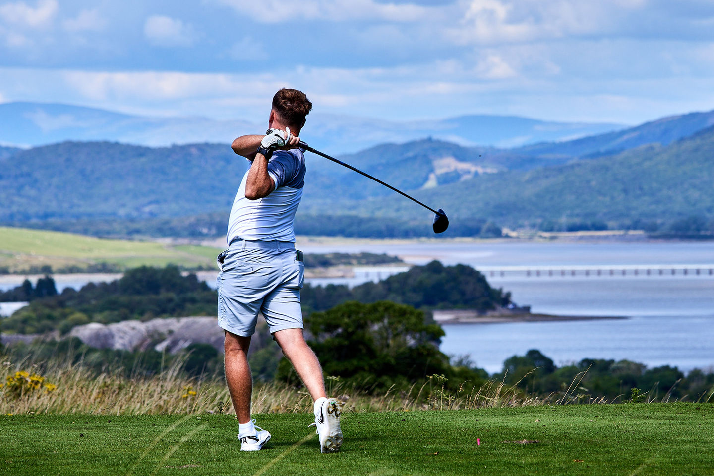 Golfer teeing off, Ulverston Golf Club event photography