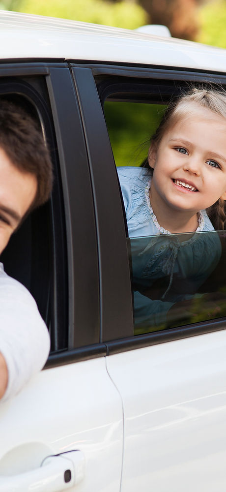 Family sitting in the car looking out windows .jpg