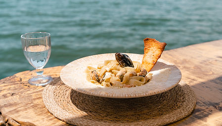 seafood-pasta-spaghetti-and-a-glass-of-water-stand-2026-01-06-09-43-09-utc.jpg