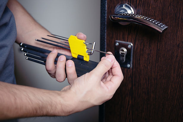 closeup-male-hands-repair-installing-metal-door-lock-with-screwdriver-improved-robbery-pro