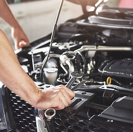 close-up-hands-unrecognizable-mechanic-doing-car-service-maintenance.jpg