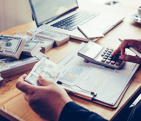 businessmen-are-working-dollars-calculating-profits-earning-results.jpg