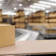 cardboard-box-tabletop-blurred-background-modern-distribution-warehouse.jpg