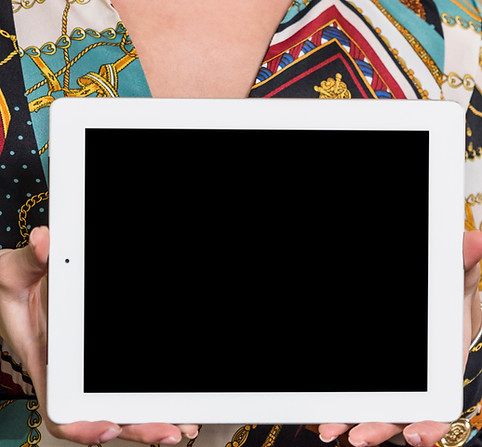 woman-standing-with-tablet-green-house.jpg