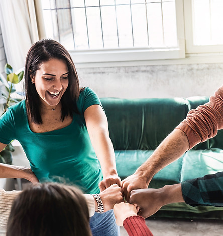 happy-multi-ethnic-friends-portrait-standing-campus-room-while-making-fist-bump-as-symbol-