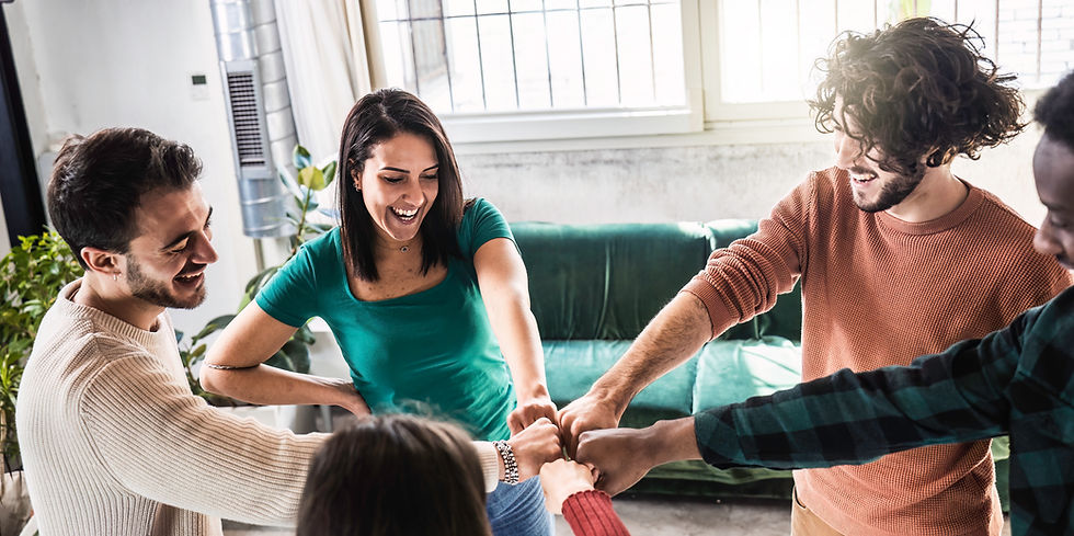happy-multi-ethnic-friends-portrait-standing-campus-room-while-making-fist-bump-as-symbol-