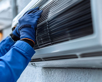 air-conditioning-technician-blue-clothes-repairing-ac-unit_edited.jpg