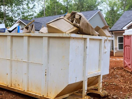 A white roll off Dumpster