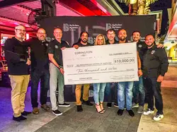 team with a donation check