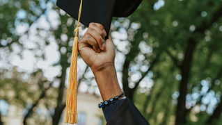 girl holding graduation cap 