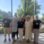 Group of people in front of window